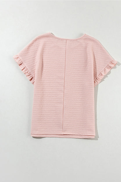 Hellrosa Bluse mit Rüschen und einfarbiger Struktur