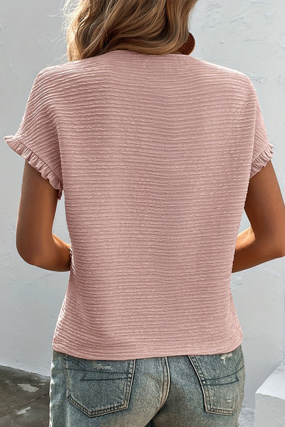 Hellrosa Bluse mit Rüschen und einfarbiger Struktur