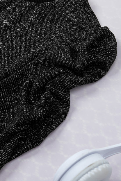 Schwarzes, schmal geschnittenes Strickoberteil mit Gigot-Ärmeln in Metallic-Optik