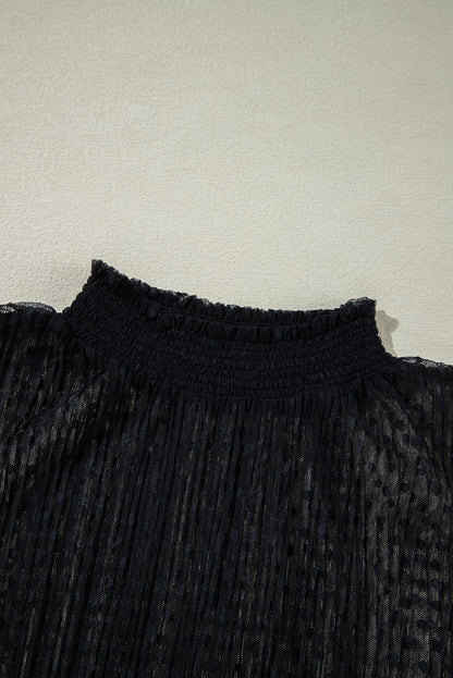 Schwarze Bluse mit transparenter Spitze und Stehkragen und langen Ärmeln