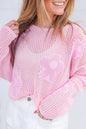 Hellrosa Strickpullover mit großer Blume und tief angesetzter Schulterpartie