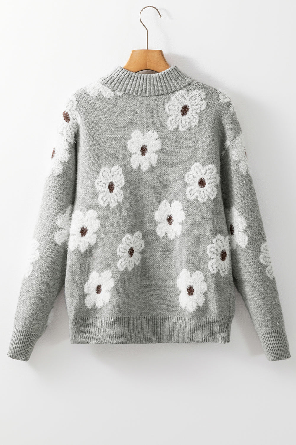 Grauer Pullover mit Blumenmuster und halblangem Reißverschluss sowie überschnittenen Schultern