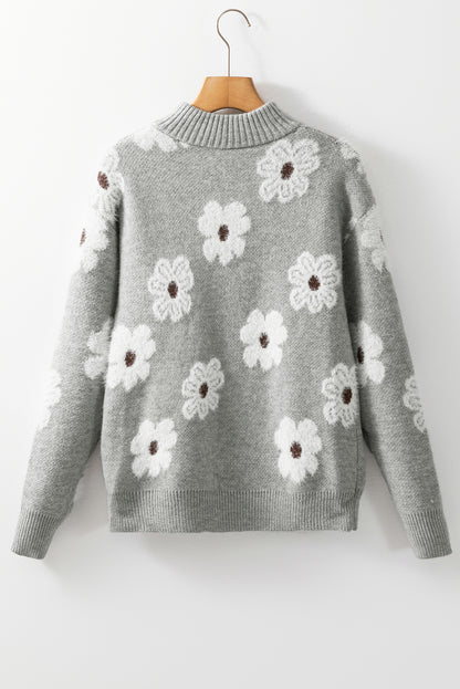 Grauer Pullover mit Blumenmuster und halblangem Reißverschluss sowie überschnittenen Schultern