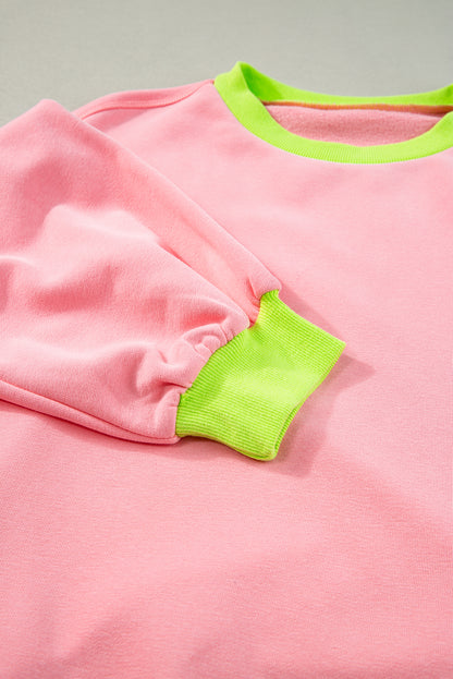 Rosa Sweatshirt mit Farbblock-Muster und Puffärmeln