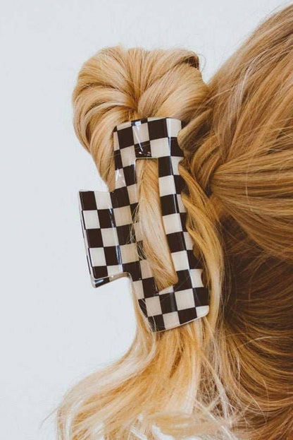 Schwarze Haarspange mit Karomuster und Aussparungen