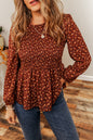 Boho-Bluse mit Blumenmuster, gesmokten Büsten und Rüschen und Schößchen