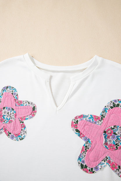 Weißes Top mit V-Ausschnitt und Dolman-Ärmeln und Blumenapplikation