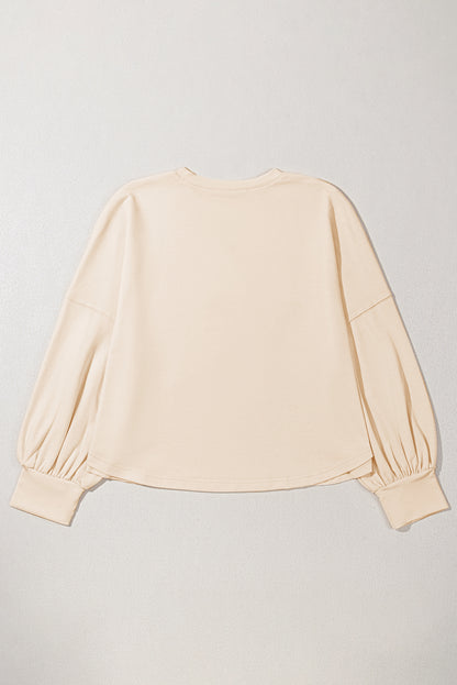 Beiges T-Shirt mit Rundhalsausschnitt und Nieten in Sternform in Übergröße