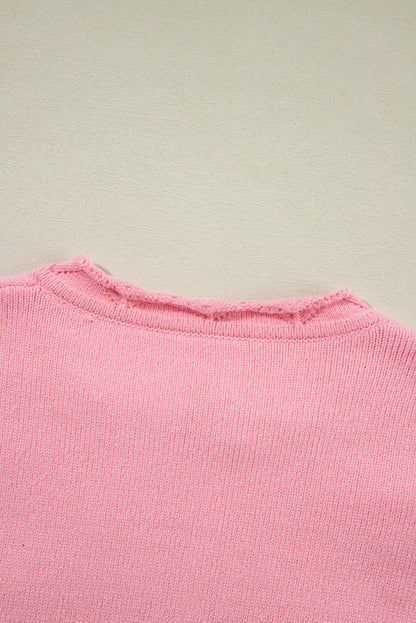 Gestrickter Pullover mit gekerbtem Kragen und Pfirsichblüten-Detail