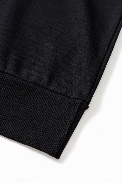 Schwarzes Lametta-Sweatshirt mit Game Day-Grafik und überschnittener Schulter