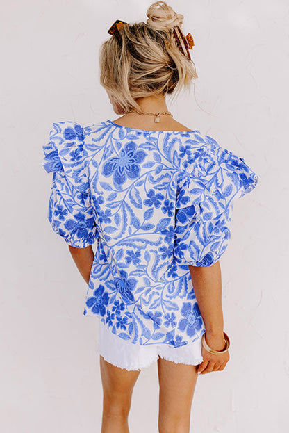 Dunkelblaue Bluse mit Blumenmuster und Rüschen und Puffärmeln