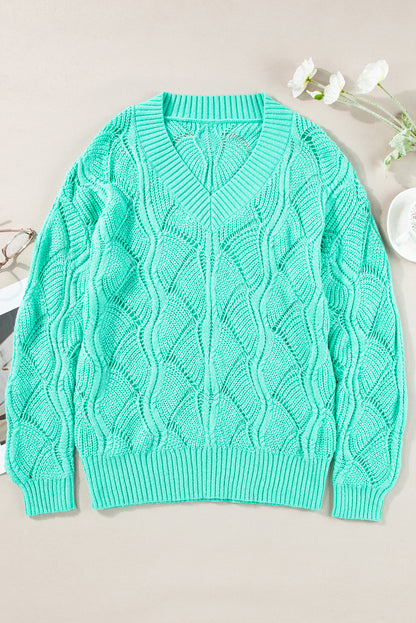Mintgrüner Strickpullover mit V-Ausschnitt und überschnittenen Schultern