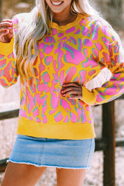 Vitality – Orangefarbener Baggy-Pullover mit abstraktem Print und geripptem Saum
