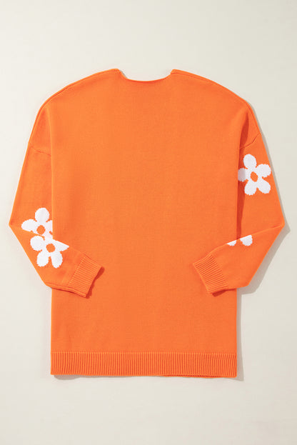 Orangefarbener, lockerer Strickcardigan mit Blumenmuster und offener Vorderseite