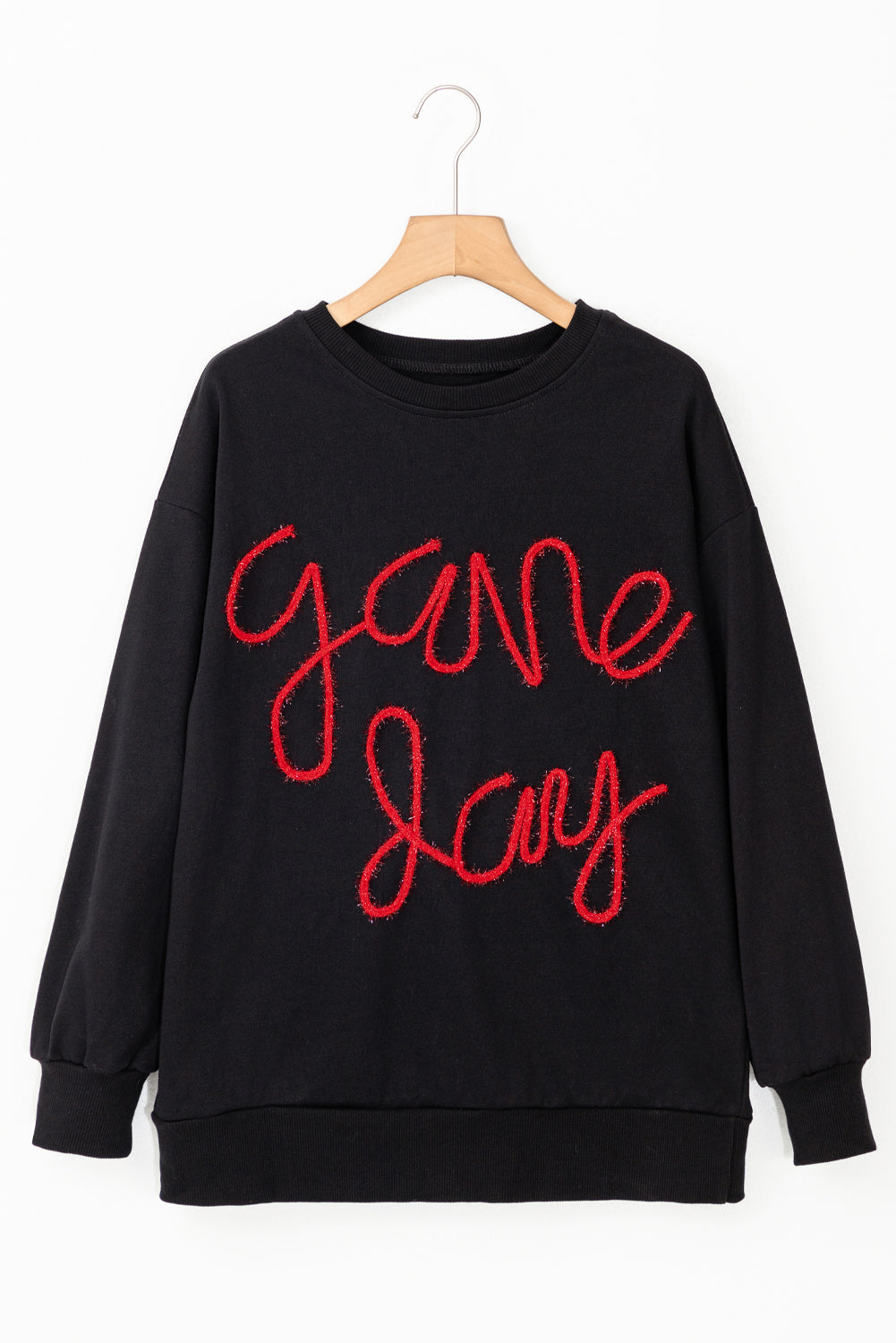 Schwarzes Lametta-Sweatshirt mit Game Day-Grafik und überschnittener Schulter