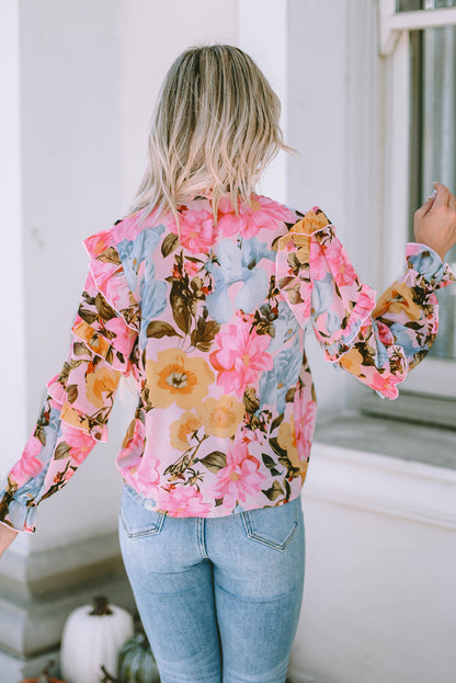 Rosa Bluse mit Blumenmuster und Rüschen