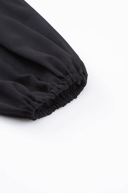Schwarzes Langarm-Top mit One-Shoulder-Träger aus Netzstoff