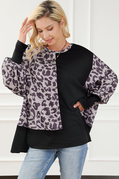 Schwarzes Sweatshirt mit Leoparden-Patchwork und Schlitzen im Bischofsärmel-Stil