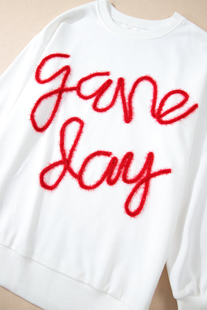 Weißes Lametta-Sweatshirt mit Game Day-Grafik und überschnittener Schulter