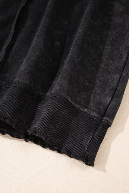 Schwarzes Sweatshirt mit Raglanärmeln und Waffelstrick-Patchworkmuster