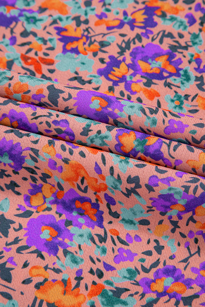 Lila Bluse mit Rundhalsausschnitt, Blumenmuster und gerafften Bündchen