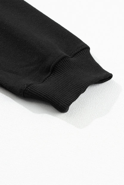 Schwarzes Sweatshirt mit „Merry Every Thing“-Lametta-Slogan