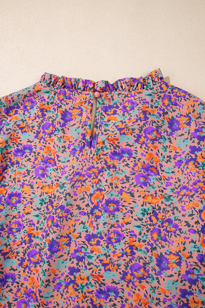 Lila Bluse mit Rundhalsausschnitt, Blumenmuster und gerafften Bündchen