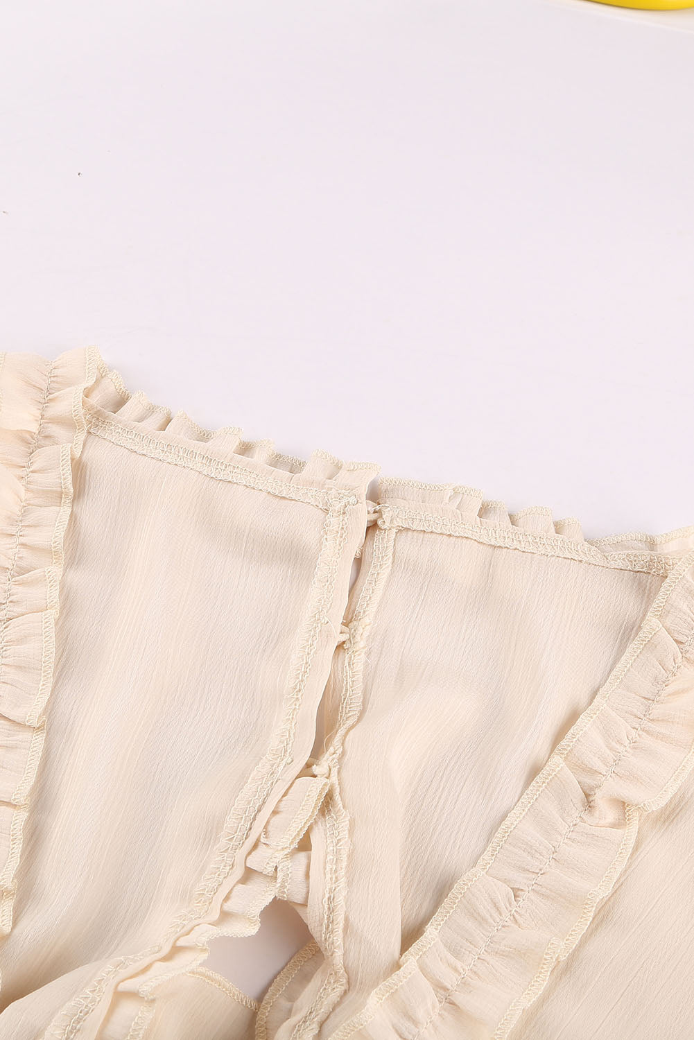 Beiges Kleid mit V-Ausschnitt und Rüschendetail und offenem Rücken