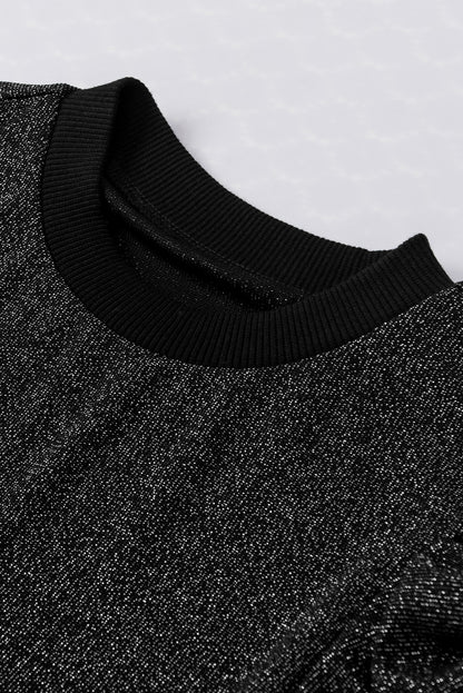Schwarzes, schmal geschnittenes Strickoberteil mit Gigot-Ärmeln in Metallic-Optik