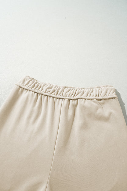 Aprikosenfarbene, lässige Hose mit weitem Bein und Kordelzug