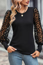 Schwarzes Slim Fit-Top mit Leopardenmuster und Puffärmeln im Patchwork-Stil aus Netzstoff