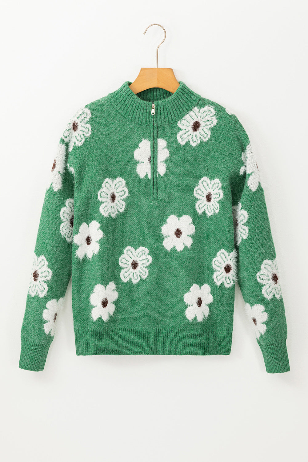 Grüner Pullover mit Blumenmuster und halblangem Reißverschluss sowie überschnittenen Schultern