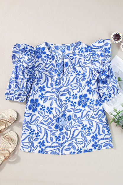 Dunkelblaue Bluse mit Blumenmuster und Rüschen und Puffärmeln