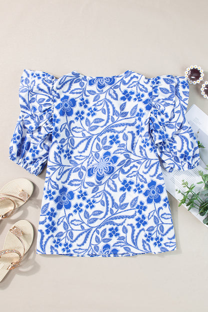 Dunkelblaue Bluse mit Blumenmuster und Rüschen und Puffärmeln