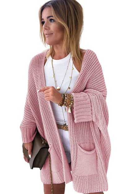 Rosafarbener Oversize-Strickpullover mit umgeschlagenen Ärmeln