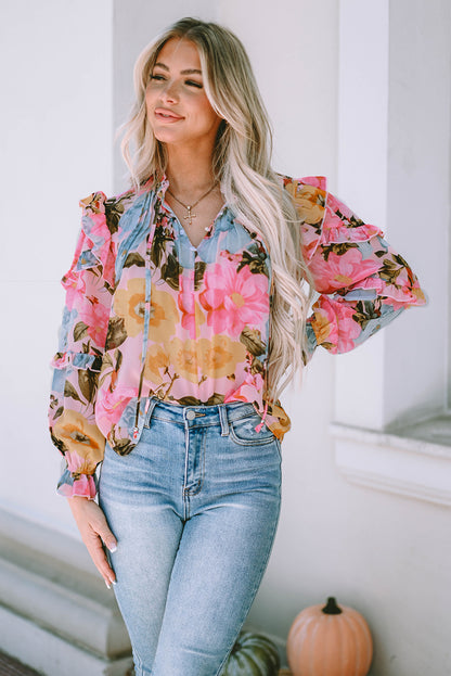 Rosa Bluse mit Blumenmuster und Rüschen