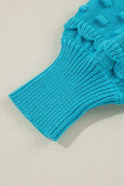 Türkisfarbener Pullover mit gerüschten Ösenärmeln