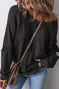 Schwarzes Sweatshirt mit Raglanärmeln und Waffelstrick-Patchworkmuster