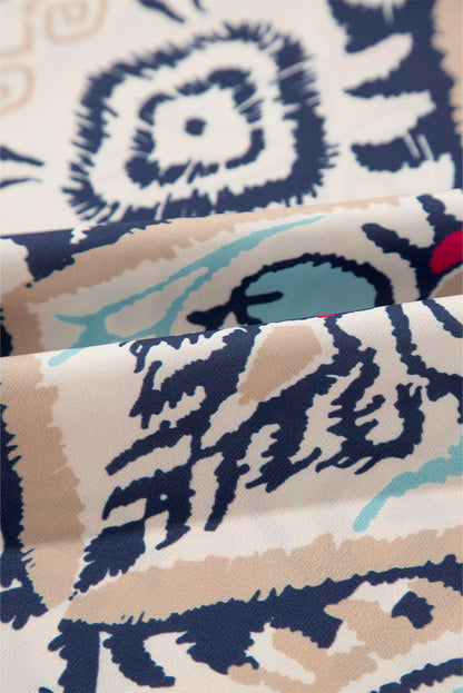Weiße Bluse mit abstraktem Print und V-Ausschnitt, geschlitzten Halbarm
