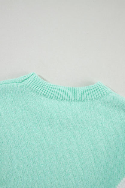 Grüner Pullover mit Chevron-Farbblock und überschnittener Schulter im Rippenstrick