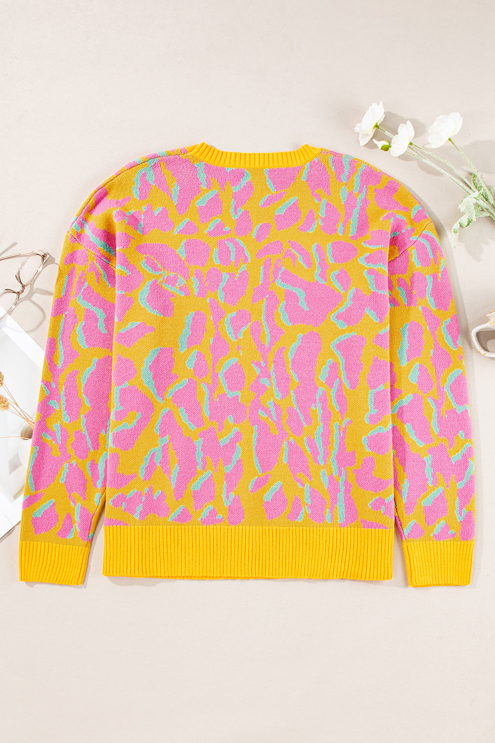 Vitality – Orangefarbener Baggy-Pullover mit abstraktem Print und geripptem Saum