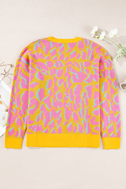 Vitality – Orangefarbener Baggy-Pullover mit abstraktem Print und geripptem Saum