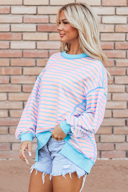 Rosa gestreiftes High-Low-Pullover-Tunika-Sweatshirt mit Kontrastbesatz