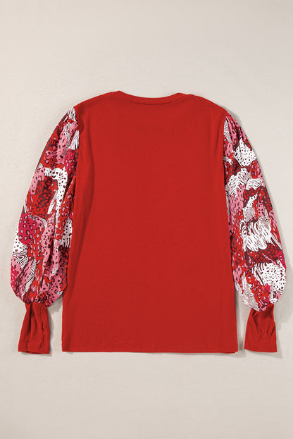 Feuerrotes Patchwork-Oberteil mit kontrastierendem Animalprint und Laternenärmeln