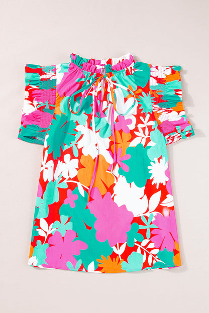 Grüne Bluse mit Blumenmuster, Krawatte, Schlitz am Hals und Rüschenbesatz