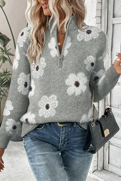 Grauer Pullover mit Blumenmuster und halblangem Reißverschluss sowie überschnittenen Schultern