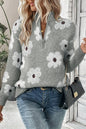 Grauer Pullover mit Blumenmuster und halblangem Reißverschluss sowie überschnittenen Schultern