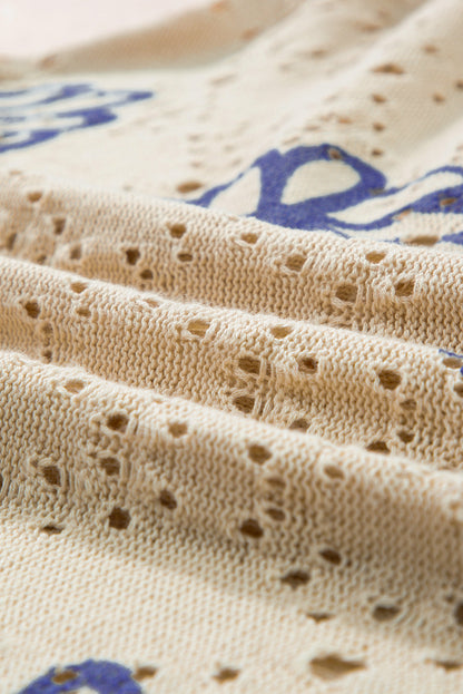 Beigefarbener Pullover mit kontrastierendem Blumenmuster und überschnittener Schulter