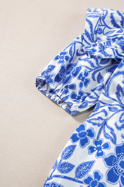 Dunkelblaue Bluse mit Blumenmuster und Rüschen und Puffärmeln