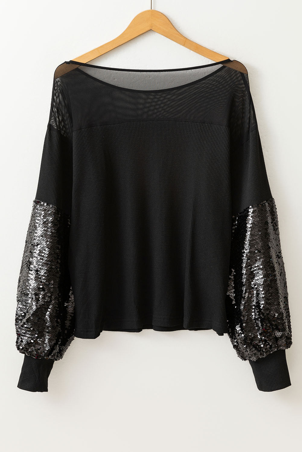 Schwarze Bluse mit Pailletten-Patchwork und Laternenärmeln